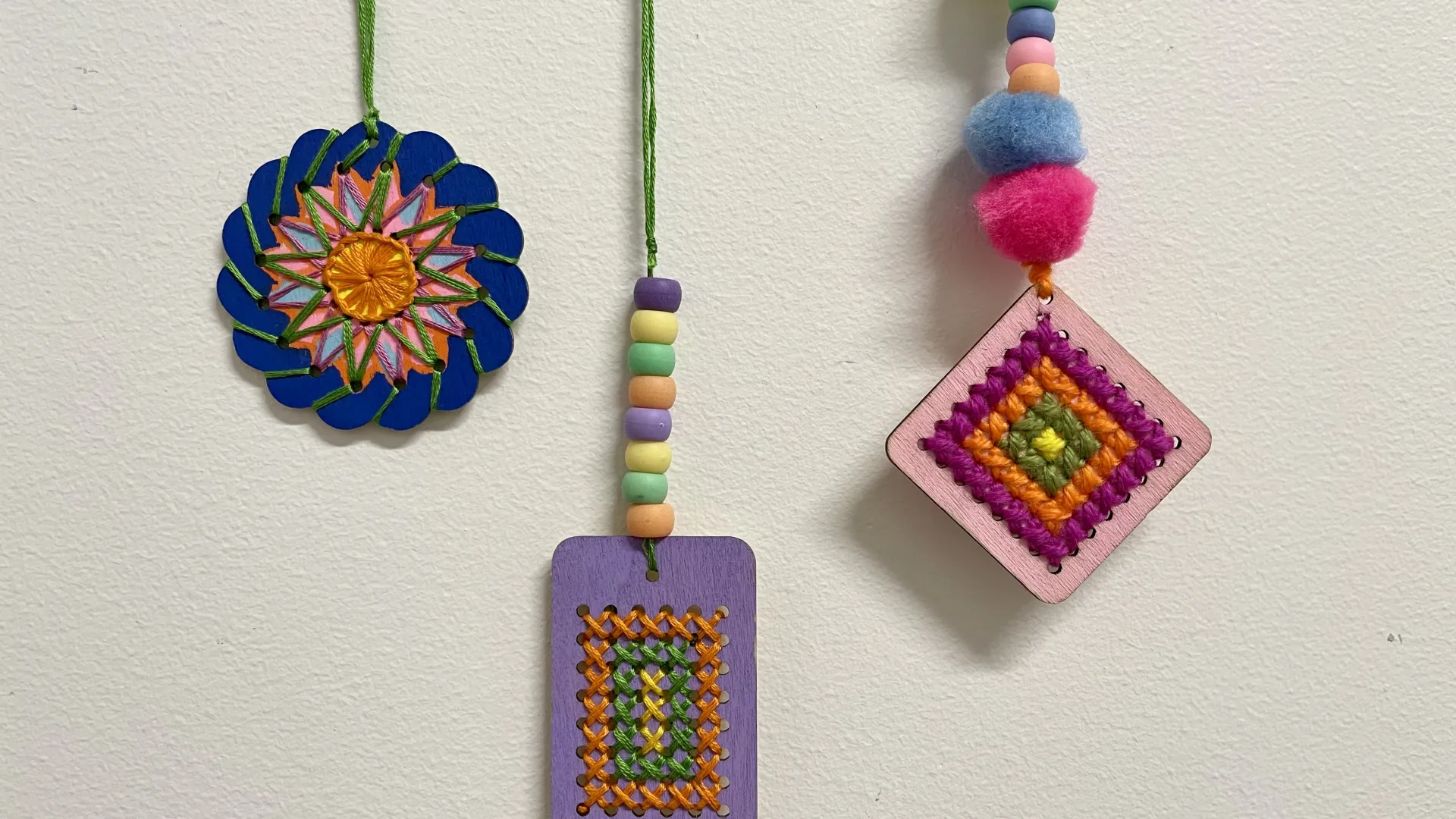 embroidered wooden shapes